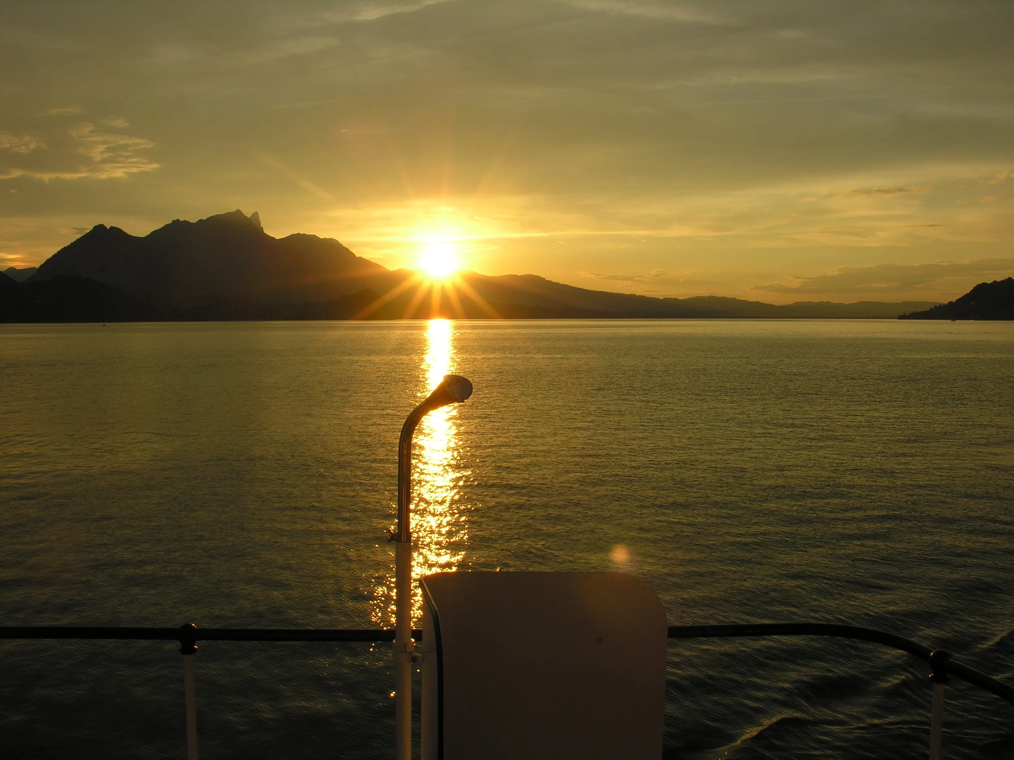 Downgoing sun on the boat Bluemlisalp